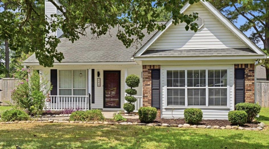 Single-story home exterior with low-maintenance landscaping, a senior-friendly aging in place property